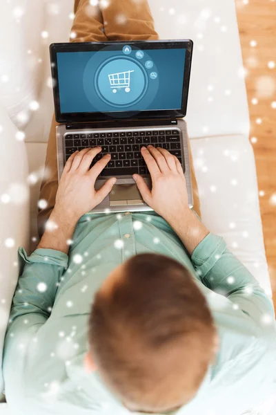 Close up of man working with laptop at home — Stock Photo, Image