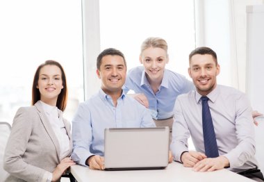business team working with laptop in office clipart