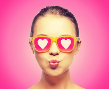 girl in pink sunglasses blowing kiss clipart