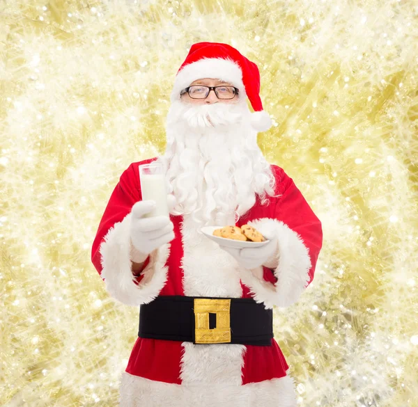 Santa claus with glass of milk and cookies — Stock Photo, Image