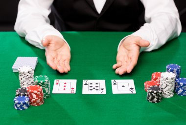 holdem dealer with playing cards and casino chips clipart