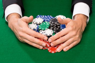 poker player with chips at casino table clipart