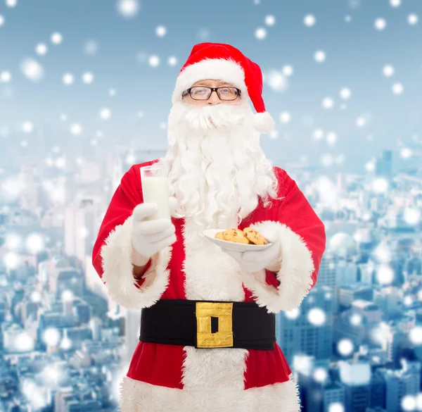 Santa claus with glass of milk and cookies — Stock Photo, Image