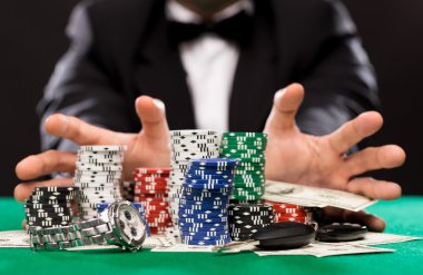 poker player with chips and money at casino table clipart