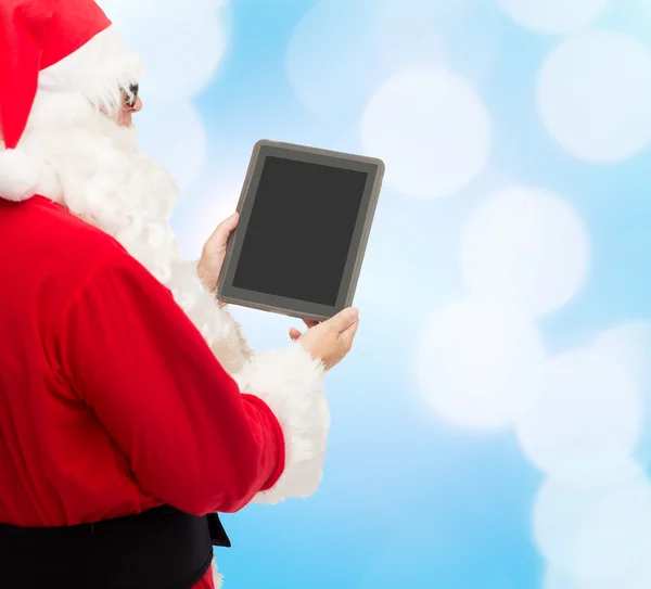 Man in costume of santa claus with tablet pc — Stock Photo, Image