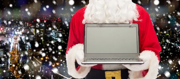 关在圣诞老人的以笔记本电脑 — 图库照片