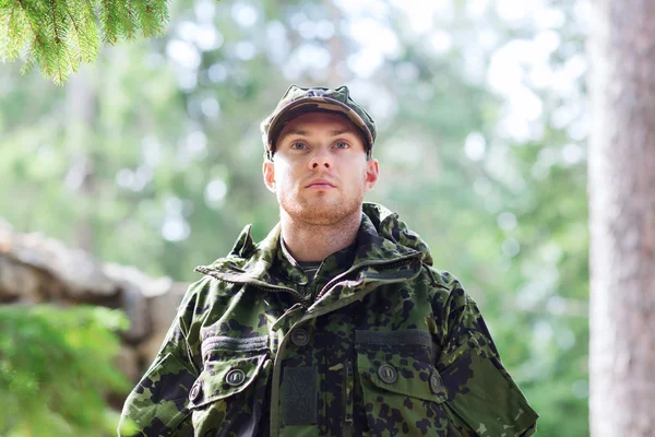 Young soldier or ranger in forest — Stock Photo, Image