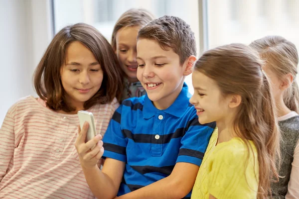 Group of school kids taking selfie with smartphone — Stock Photo, Image