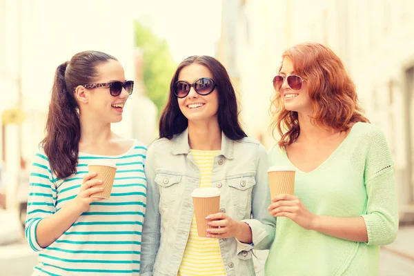 Smiling teenage girls with on street — Stock Photo, Image