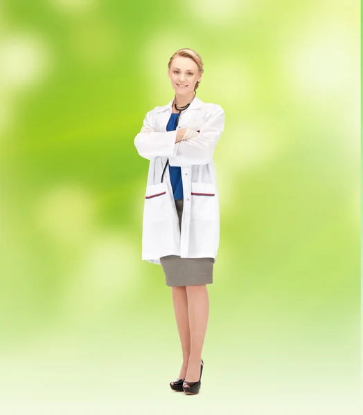 Smiling young female doctor in white coat — Stock Photo, Image