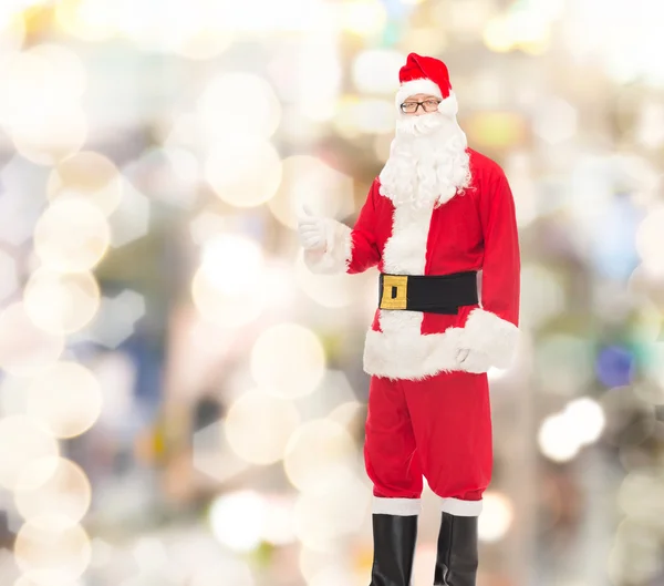 Man in costume of santa claus showing thumbs up — Stock Photo, Image