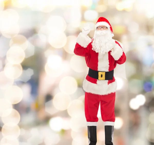 Homme en costume de Père Noël claus avec sac — Photo