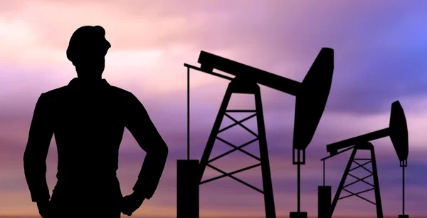 Black silhouette of oil worker and pump jack — Stock Photo, Image