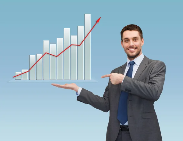 Šťastný muž zobrazeno růstu graf na dlani — Stock fotografie