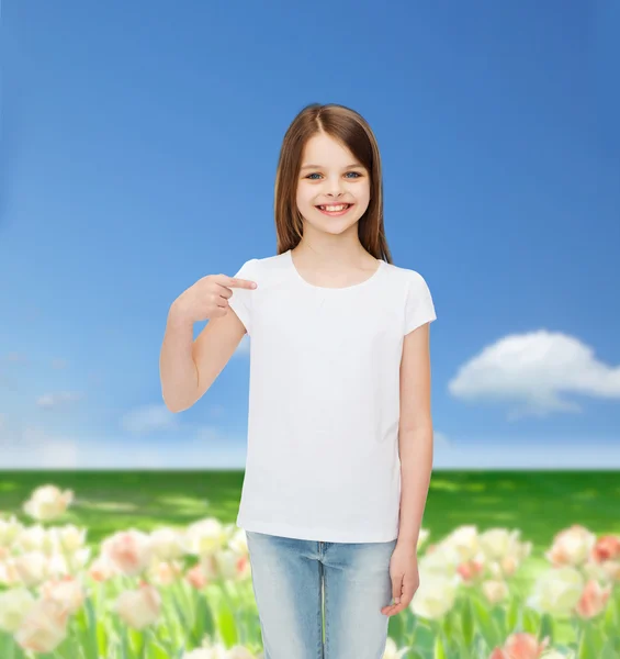 Smiling little girl in white blank t-shirt — Stock Photo, Image