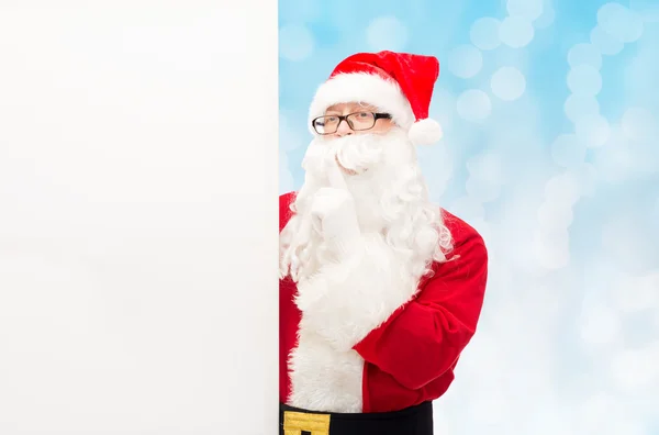 Man in costume of santa claus with billboard — Stock Photo, Image