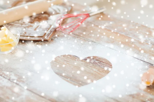 Heart of flour on wooden table at home — Stock Photo, Image