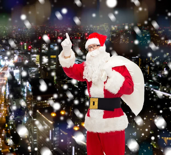 Homme en costume de Père Noël claus avec sac — Photo