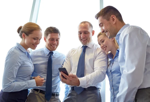 Happy businesspeople with smartphone — Stock Photo, Image