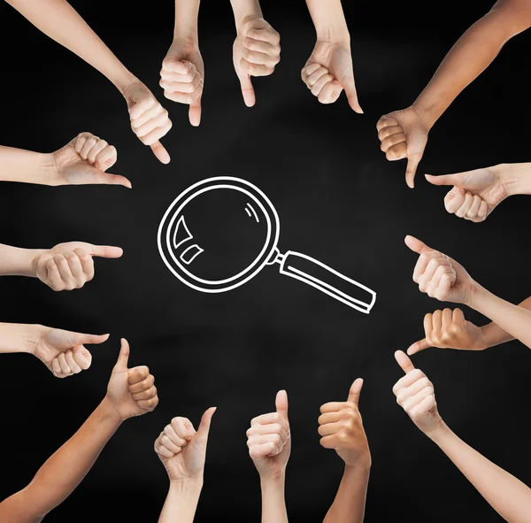 Hands showing thumbs up in circle over magnifier — Stock Photo, Image