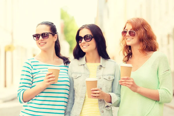 Smiling teenage girls with on street — Stock Photo, Image