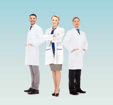group of smiling doctors in white coats clipart