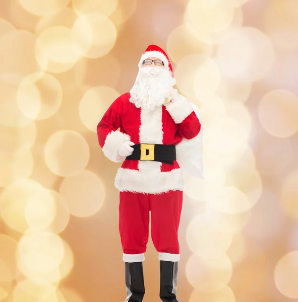 Man in costume of santa claus with bag — Stock Photo, Image