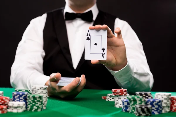 Holdem dealer with playing cards and casino chips — Stock Photo, Image