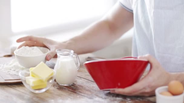 Close up of male hand whisking something in a bowl — Stock Video