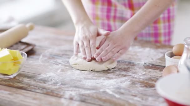 Close up of female hands kneading dough at home — Stock Video