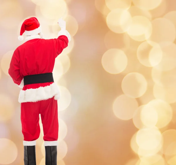 Muž v kostýmu santa Clause psát něco — Stock fotografie