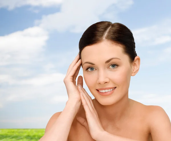 Smiling young woman with bare shoulders — Stock Photo, Image