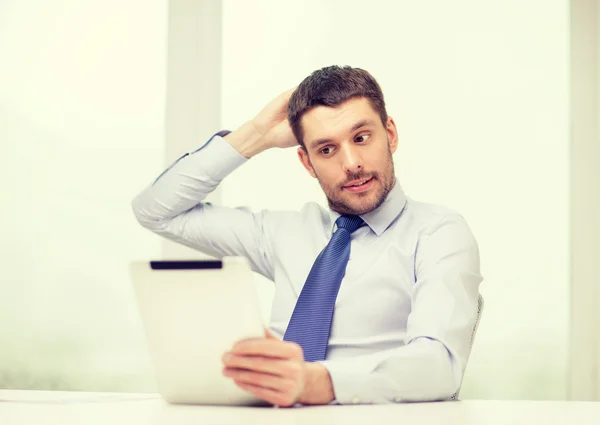 Stressed businessman with tablet pc and documents — Stock Photo, Image