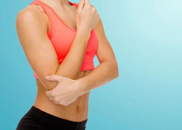 Sporty woman with pain in elbow — Stock Photo, Image