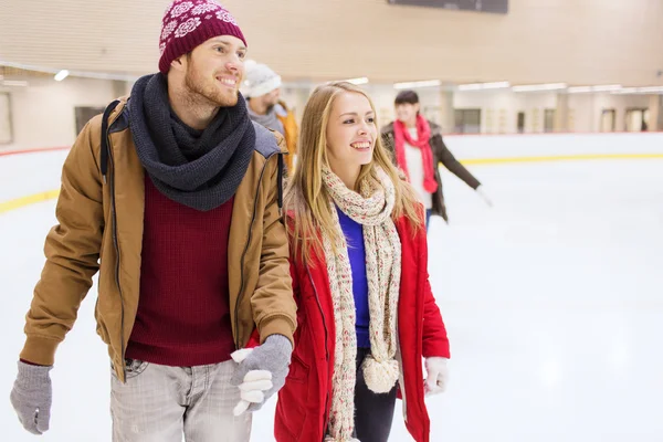 Happy friends on skating rink — Stock Photo, Image