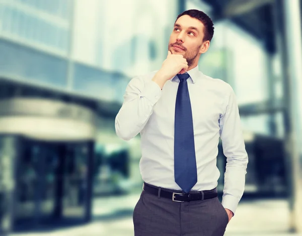 Handsome businessman looking up — Stock Photo, Image