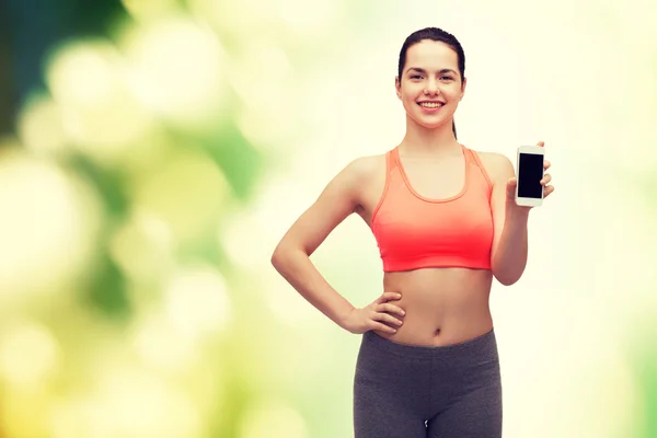 Sportliche Frau mit Smartphone — Stockfoto