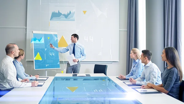 Group of smiling businesspeople meeting in office — Stock Photo, Image