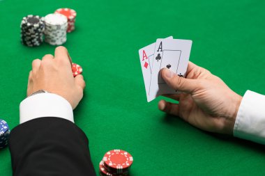 poker player with cards and chips at casino clipart