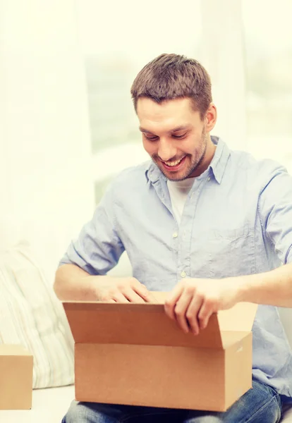 Man with cardboard boxes at home — Stock Photo, Image