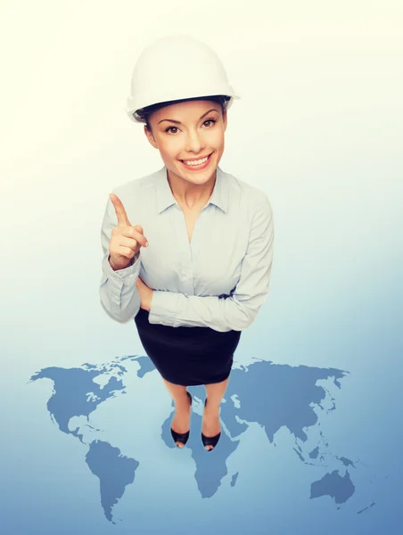 Businesswoman in white helmet with finger up — Stock Photo, Image