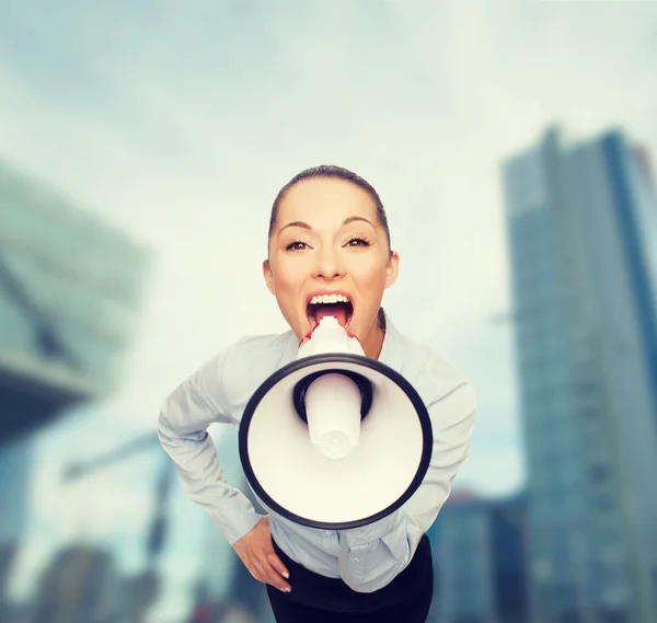 Screaming businesswoman with megaphone — Stock Photo, Image