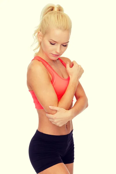 Sporty woman with pain in elbow — Stock Photo, Image
