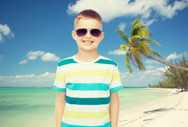 Smiling little boy over green background — Stock Photo, Image