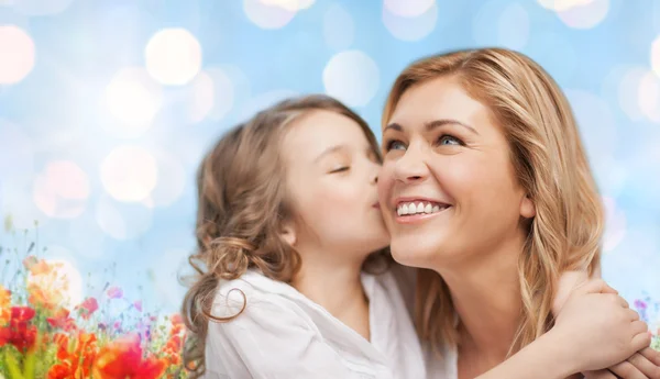 Happy mother and daughter hugging — Stock Photo, Image
