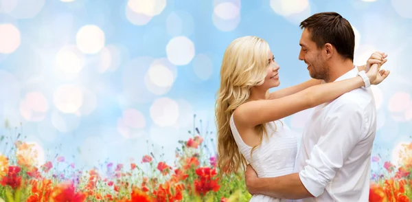 Happy couple hugging over natural background — Stock Photo, Image