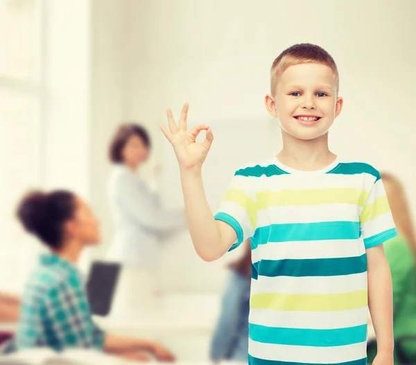 Little boy in casual clothes making ok gesture — Stock Photo, Image