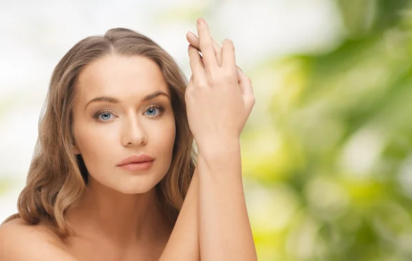 Beautiful woman face and hands — Stock Photo, Image