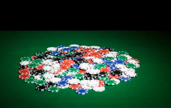 Close up of casino chips on green table surface — Stock Photo, Image