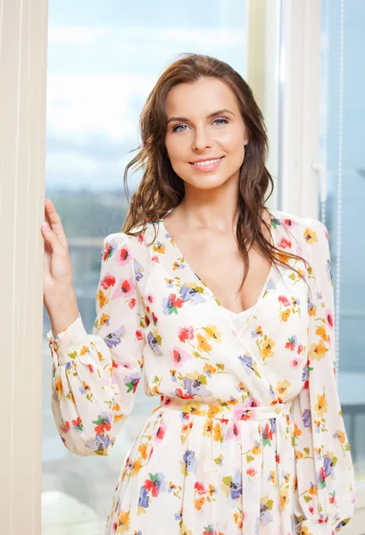 Mujer feliz en la ventana —  Fotos de Stock